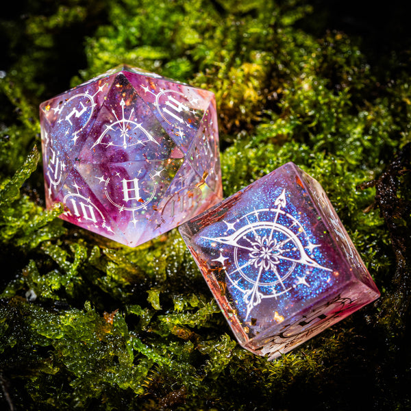 a close up of two dices on a bed of moss