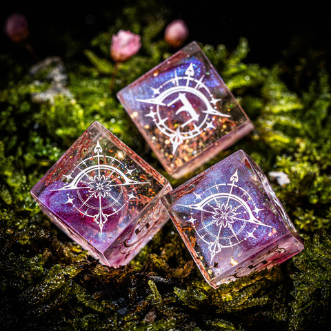 three glass cubes sitting on top of a moss covered ground