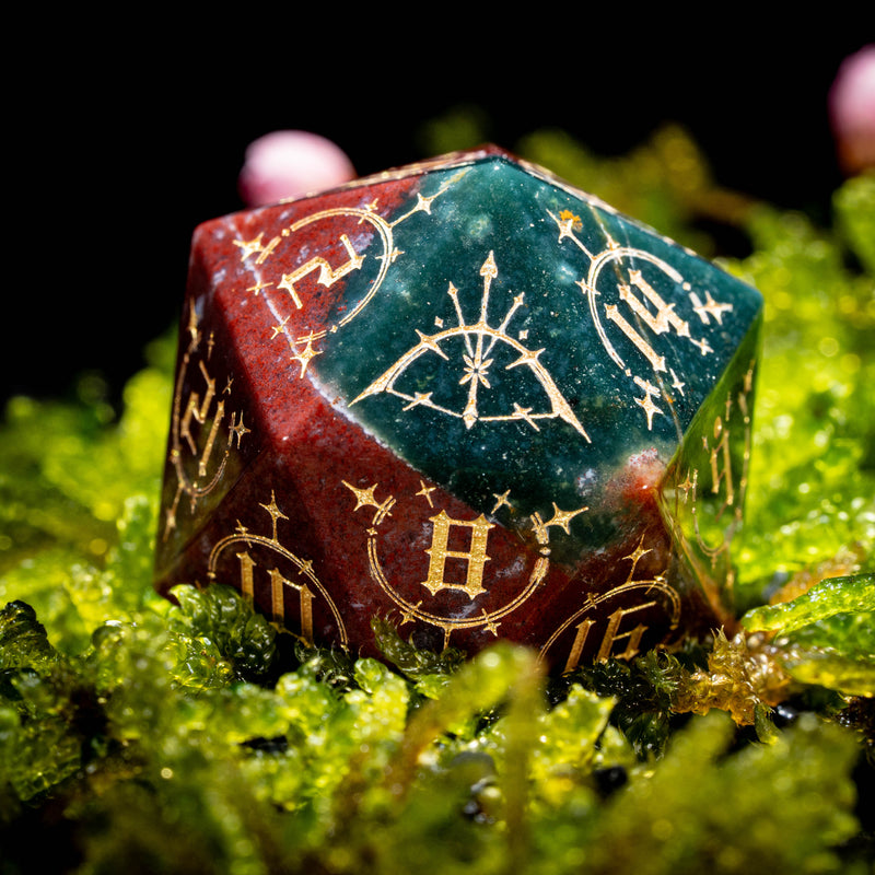 a close up of a dice on a bed of moss