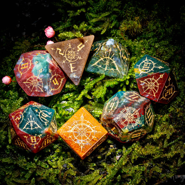 a group of dices sitting on top of a lush green field