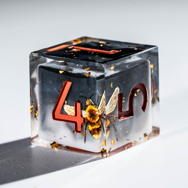a glass block with the number four and a bee on it