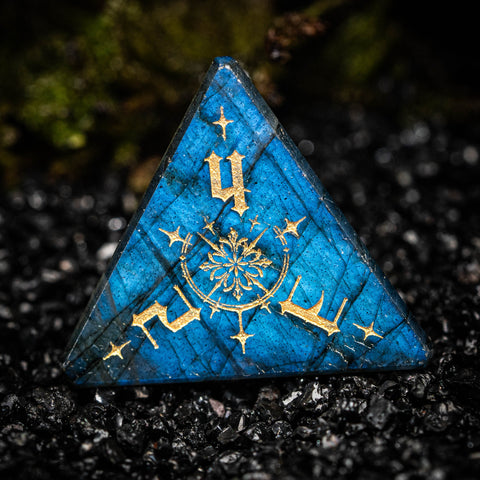 a blue triangle with gold lettering on it