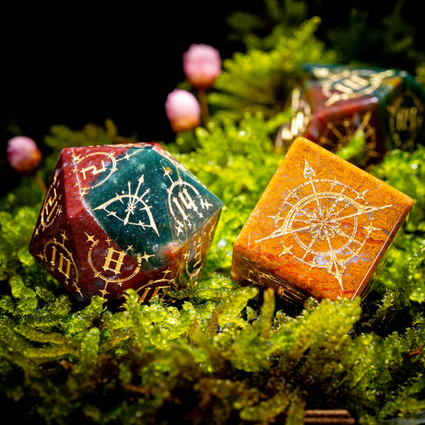 a close up of two dices on a bed of moss