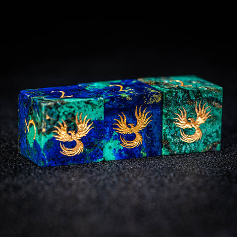 a blue and green box with gold designs on it