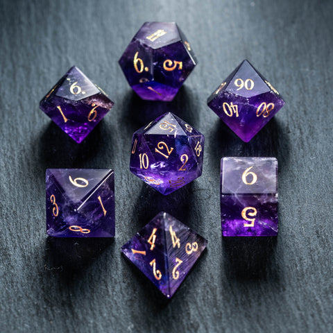 a group of purple dice sitting on top of a table