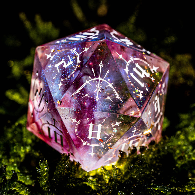 a close up of a dice on some moss