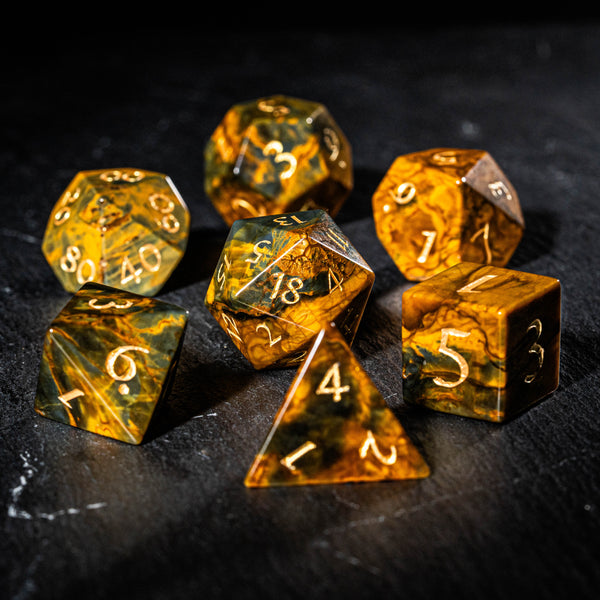 a group of yellow dice sitting on top of a table