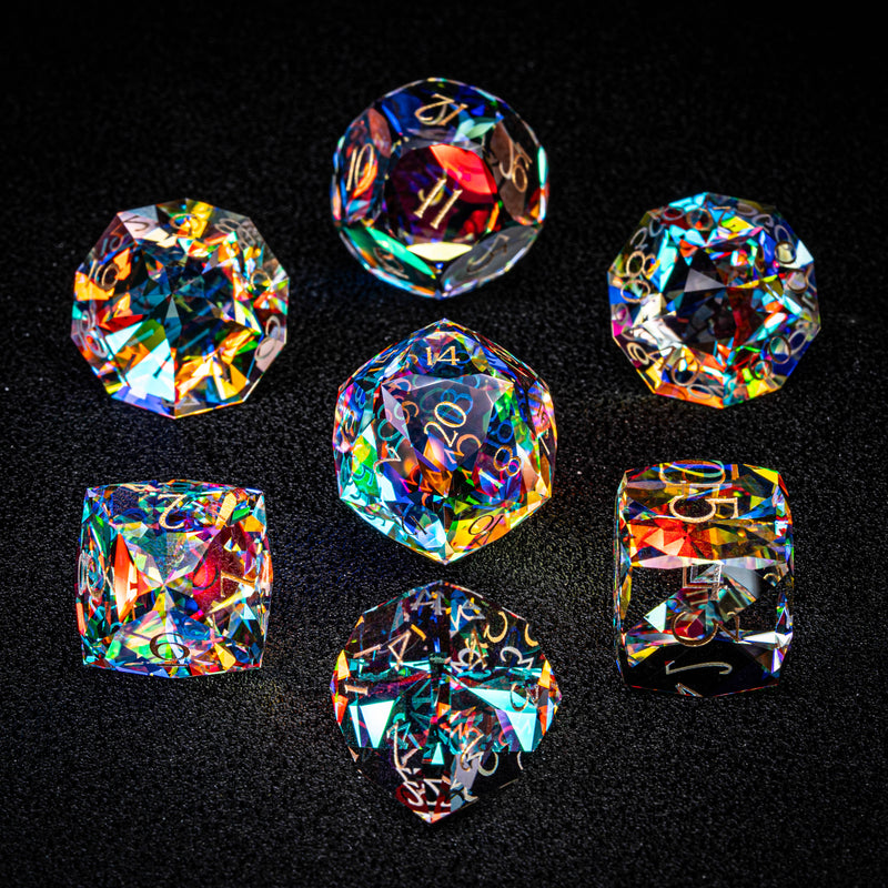 a group of different colored diamonds on a black surface