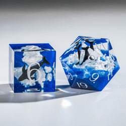 a couple of blue and white dices sitting on top of a table