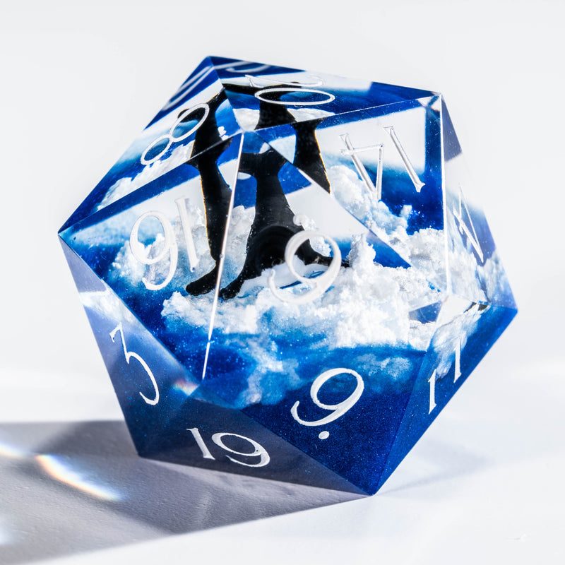 a close up of a blue and white dice