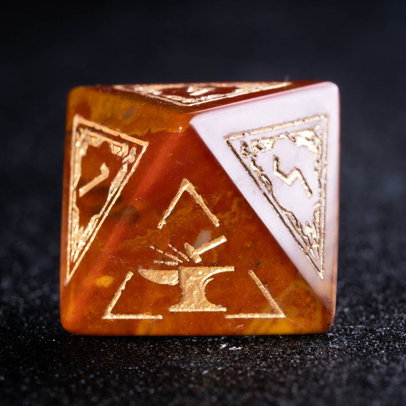 a golden and white dice sitting on top of a table