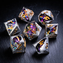 a group of metal dices sitting on top of a table