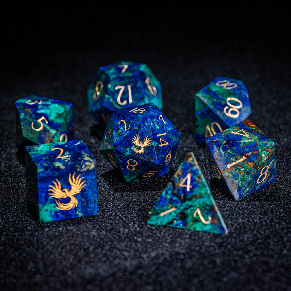 a group of blue and gold dice sitting on top of a table