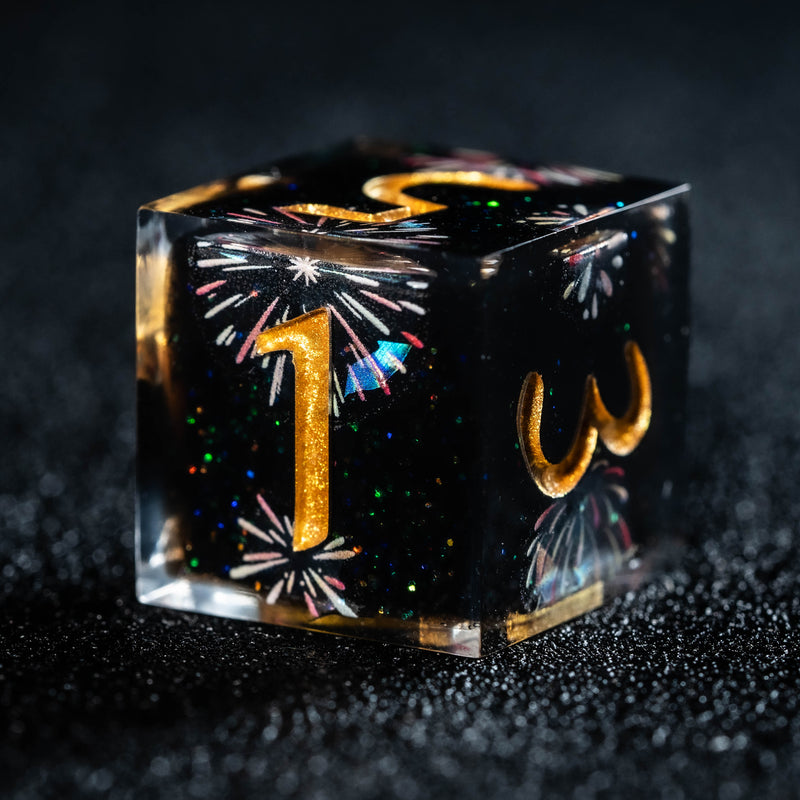 a black cube with a gold number and fireworks