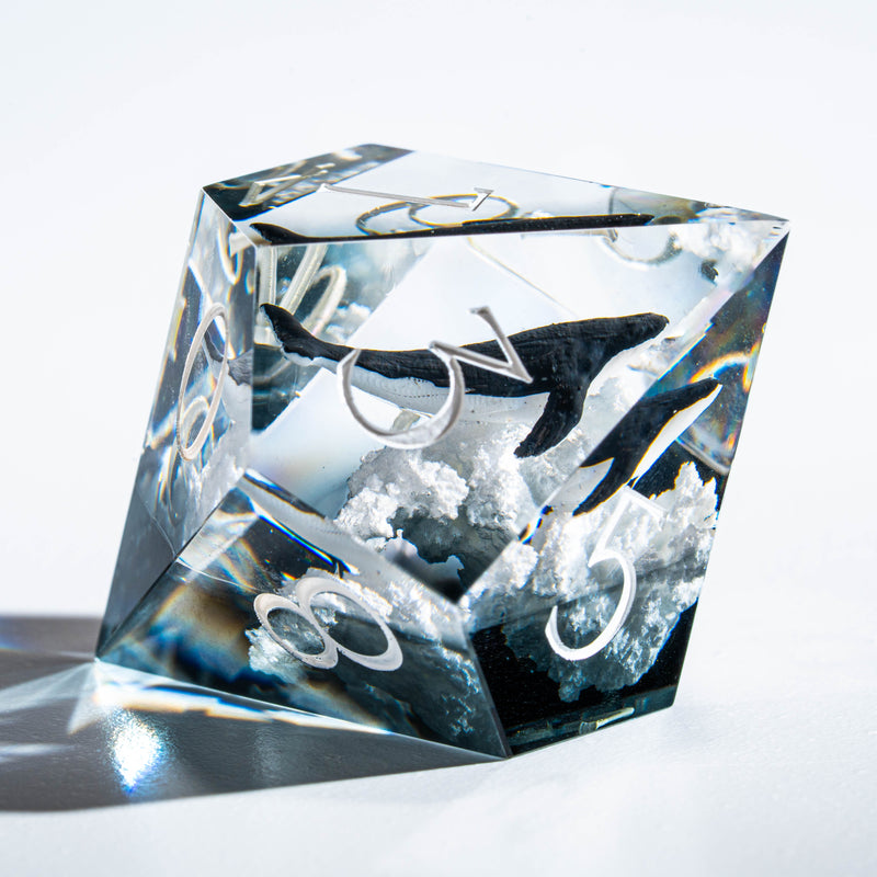 a crystal cube with a picture of a bird on it