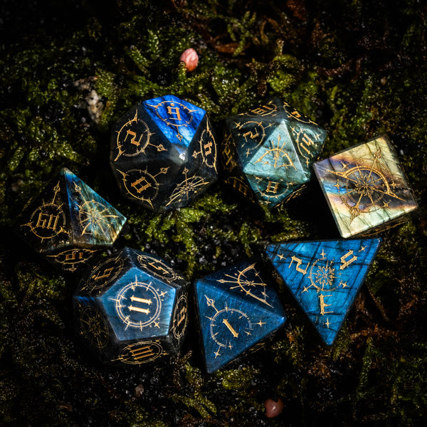 a group of dices sitting on top of a moss covered ground