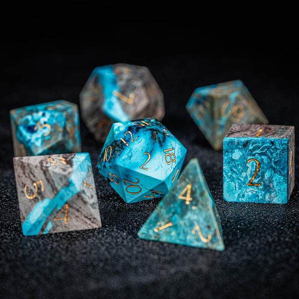 a group of blue dices sitting on top of a table