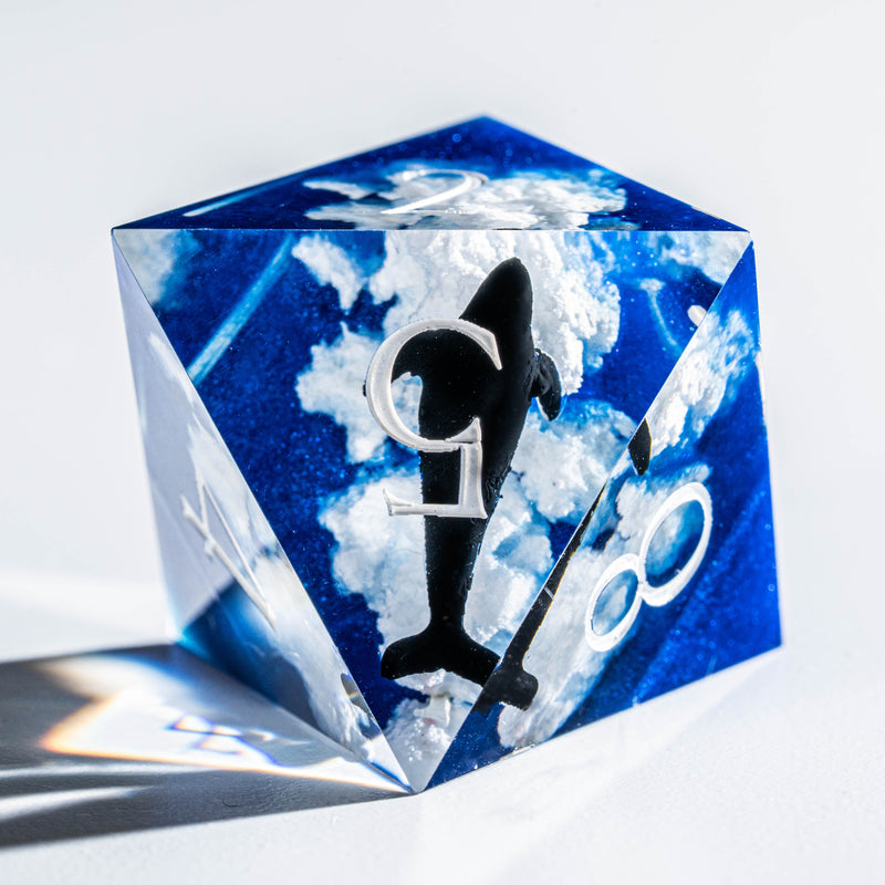 a close up of a dice on a white surface