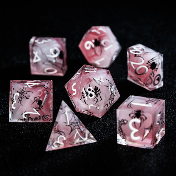 a group of pink dices sitting on top of a table