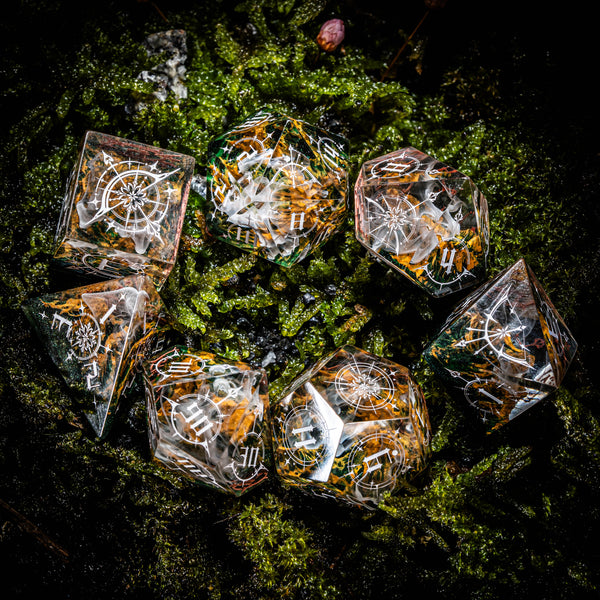 a group of dices sitting on top of a lush green field