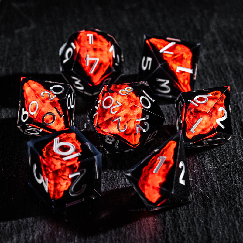 a group of red and black dice sitting on top of a table