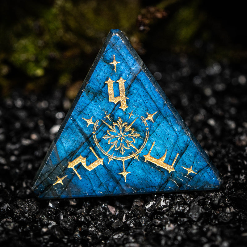 a blue triangle with gold lettering on it