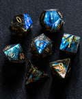 a group of blue and gold dice sitting on top of a table