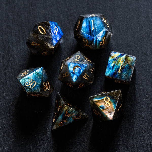 a group of blue and gold dice sitting on top of a table