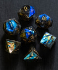 a group of blue and gold dice sitting on top of a table