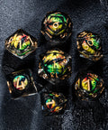 a group of glass dices sitting on top of a black surface