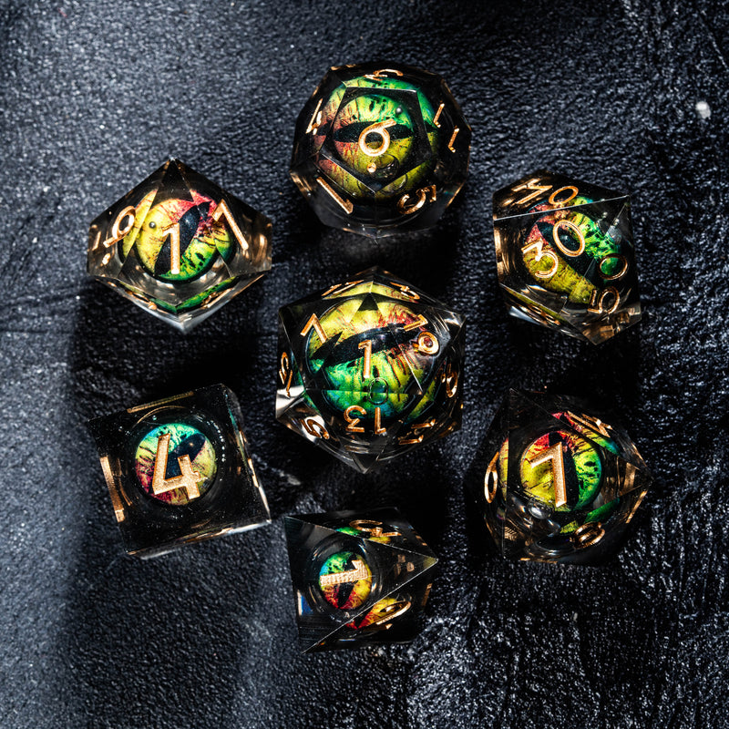 a group of glass dices sitting on top of a black surface