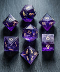 a group of purple dice sitting on top of a table