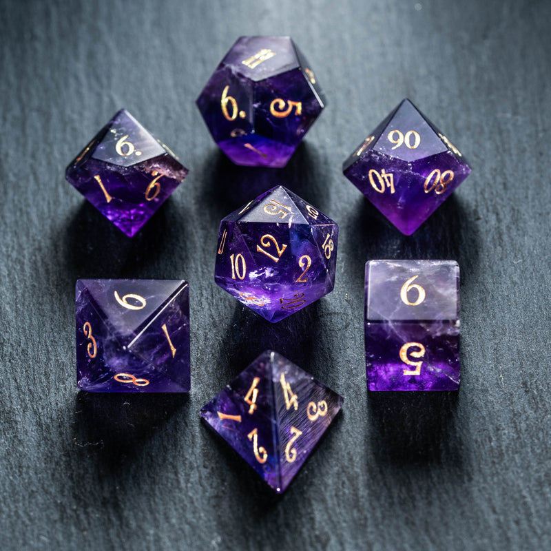a group of purple dice sitting on top of a table